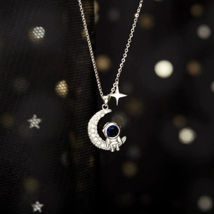 Elegant S925 sterling silver astronaut moon necklace with deep blue zircon pendant