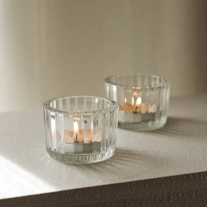 Minimalist ribbed clear glass tea light holder for elegant candlelight dinner setting
