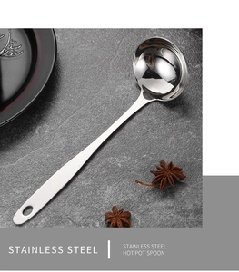Macro shot of polished stainless steel hot pot spoon with a sleek handle and hanging hole