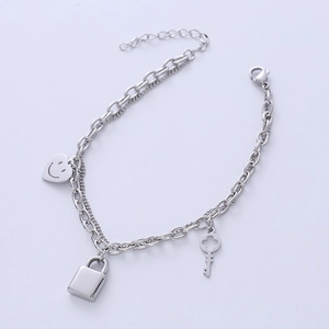 Silver titanium steel bracelet with heart smiley, lock, and key pendants in dual chain style