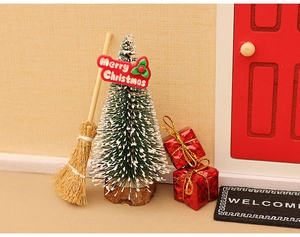 Miniature Christmas decor set featuring a tree, broom, gift boxes and welcome mat