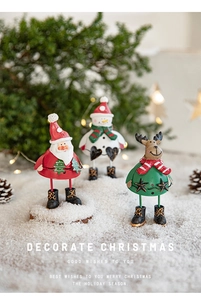 Detailed view of Santa, Snowman and Reindeer iron decorations with Christmas lights