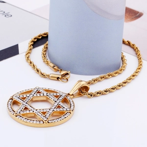 Close-up of gold hollow hexagram pendant with small crystals on a twisted chain