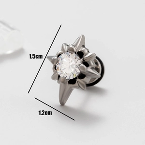 Macro view of men's stainless steel stud earring with star-shaped thorns and cubic zirconia