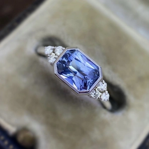 Elegant silver-plated engagement ring with blue octagonal sapphire and white zircon accents