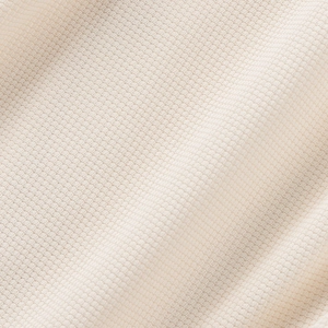 Vista macro del tejido de punto de gofre blanco roto con detalles de fibra de calidad