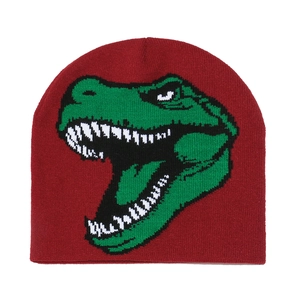 Close-up detail of knitted beanie featuring a green dinosaur pattern on dark red fabric