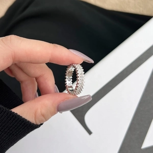 Detailed macro view of an S925 silver eternity ring featuring baguette-cut zircon stones