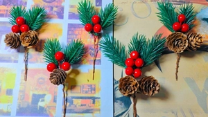 Detail of five artificial pine needles with red berries and cones for Christmas DIY crafts