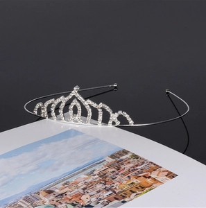 Detailed view of bridal silver metal tiara with sparkling rhinestones for weddings