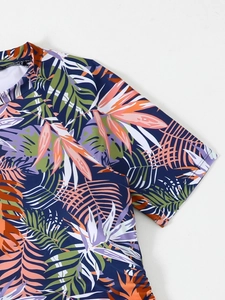 Close-up of tropical palm leaf print on short-sleeve tankini swimwear top with round neck
