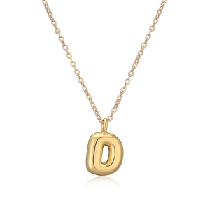 Macro shot of 18k gold plated bubble letter D pendant with fine necklace chain