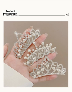 Detailed view of silver crown hair combs with rhinestones and white pearls for girls