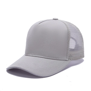Detail view of the breathable mesh back and cotton twill brim of a gray trucker hat
