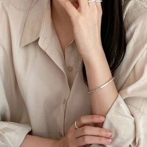 Minimalist S925 sterling silver 3mm cuff bracelet and rings set on a female model