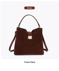 Detail of brown suede tote bag with golden square clasp and detachable shoulder strap
