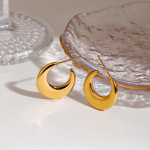 Polished 18K gold stainless steel crescent moon earrings on a minimalist white background