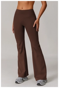 Detail of high-waisted dark brown flared yoga pants with supportive wide waistband