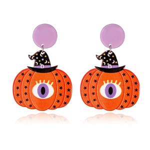 Detail of Halloween pumpkin earrings with purple eyes and a black wizard hat accessory