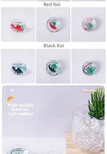 Close-up of miniature fish tank with red and black koi fish models in a micro landscape