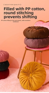 Detail of round velvet pumpkin cushion showing pp cotton filling and needle stitching