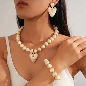 Vintage acrylic marble bead jewelry set with heart pendant necklace and gold accents