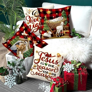 Set of 4 Christmas angel and lamb cushion covers with religious prints on a white sofa