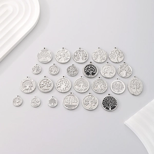 Collection of retro stainless steel Tree of Life pendants in various shapes and sizes