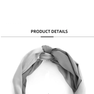 Detailed view of the chiffon daisy print headband featuring a twisted knot design