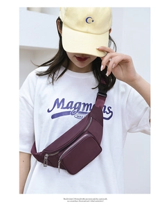 Detail view of water-resistant purple waist bag showing multi-layer zippers and buckle