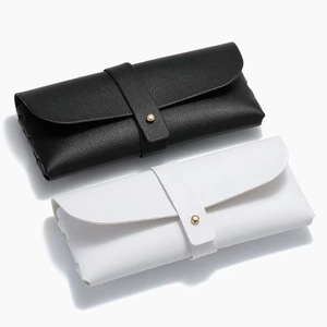 Litchi texture leather sunglasses pouch in black and white with gold snap button