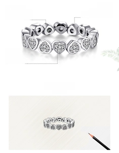 Close-up of heart-cut cubic zirconia stones hand-set in s925 sterling silver ring