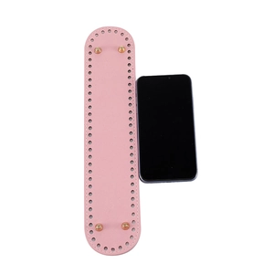 Pink PU leather oval bag base with gold metal feet and pre-punched holes for DIY crafting