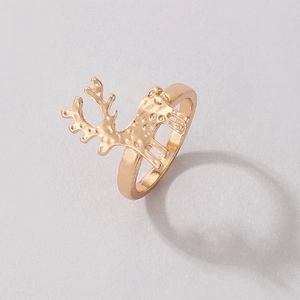 Detail of a golden elk open ring showing the hammered metal texture and festive design