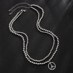 Men's double-layered silver beaded necklace featuring a circular peace sign pendant