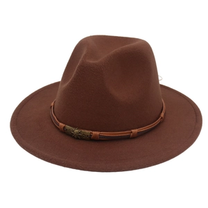 Detail of dark brown wool fedora with vintage metal skull and star emblem on cord band