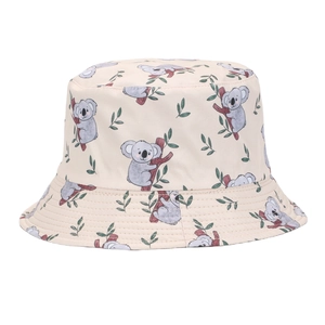 Close-up of beige sun bucket hat with cute cartoon sloth and leaf pattern detailing