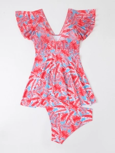Detail showing high-contrast red and blue tropical palm leaf print on two-piece swimdress