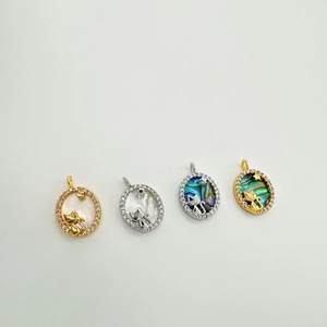 18k gold plated cat shell pendants with sparkling zircon stone accents on white background