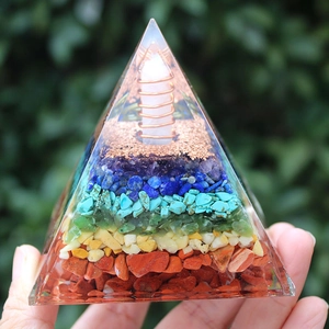 Orgone crystal pyramid with seven chakra stones and copper coil for home decor
