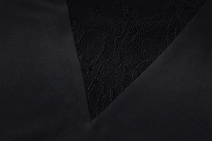 Detailed close-up of smooth black satin fabric stitched with delicate V-shaped floral lace