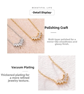 Detail showing polished gold petal pendant with marquise-cut cubic zirconia and plating
