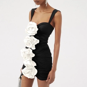 Sexy black one-piece swimsuit featuring 3D white flower embellishments and cut-outs