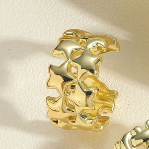 Detailed close-up of 14K gold plated five-pointed star braided adjustable open ring