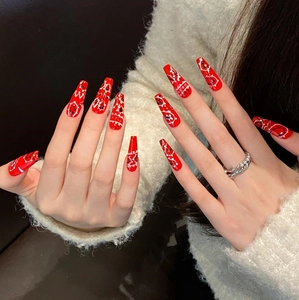 Long coffin red bandana press-on nails with black and white paisley patterns for women