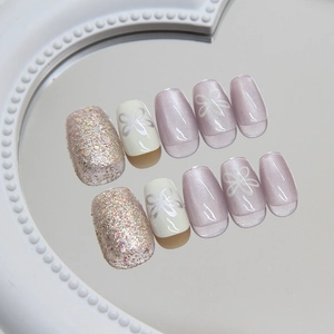 Cat eye press-on nails set with purple floral designs and silver glitter finish