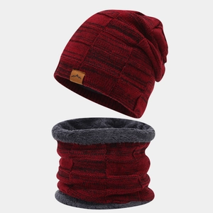 Detail of red and black checkered knit hat and neck warmer with thick faux fur lining