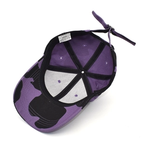 Inside view of cow print cotton baseball cap showing lining and adjustable strap
