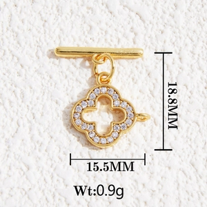 Detailed close-up of a 18K gold clover pendant with cubic zirconia and dimensions data