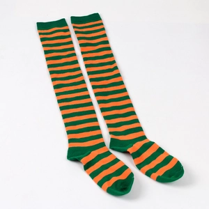 Detailed view of orange and green striped over-the-knee socks with ribbed green cuffs